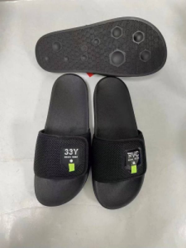 Black Slip-On Sandals with Textured Strap and Green Accent